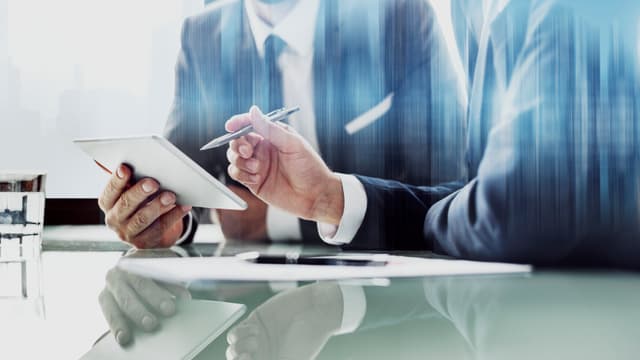 Accountant calculating profits with financial graphs